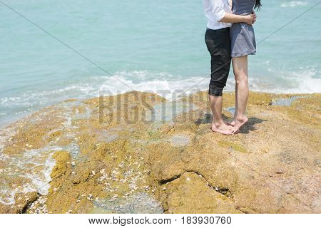 A young couple at sea in Thailand.