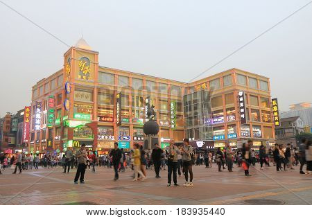 GUANGZHOU CHINA - NOVEMBER 12, 2016: Unidentified people visit Shangxiajiu pedestrian street. Shangxiajiu is the first business street in Guangzhou opened in 1995