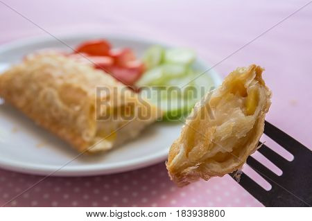 Corn pie with dish on table Corn pie with fork.