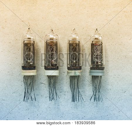 Nixie tubes indicator of the numbers retro style on craft paper background in bi colors gradient filter.
