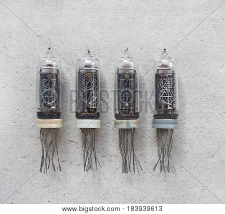 Top view of vintage USSR nixie tubes on craft paper background