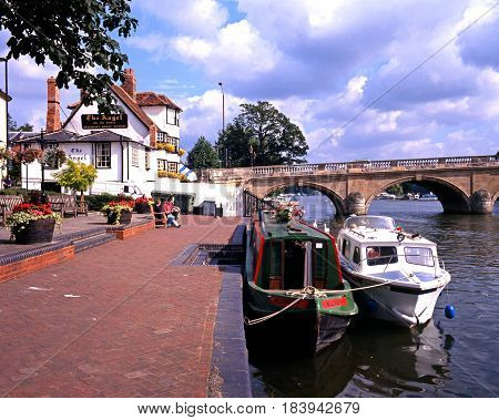 HENLEY-ON-THAMES - AUGUST 2, 1993 - Narrowboat and pleasure cruiser tied to the sidewalk on the River Thames Henley-on-Thames Oxfordshire England UK Western Europe, August 2, 1993.