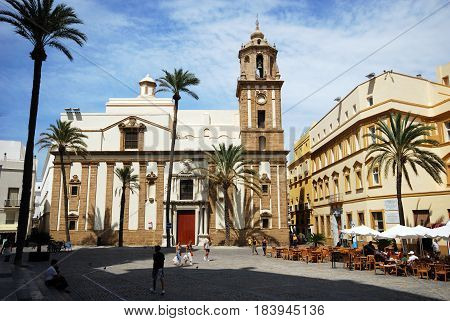 CADIZ, SPAIN - SEPTMEBER 8, 2008 - Santiago church in Cathedral Square with pavement cafes to the right hand side Cadiz Cadiz Province Andalusia Spain Western Europe, September 8, 2008.