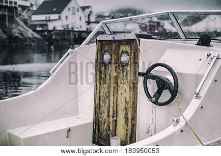 Front View of Upper Deck with Steering on Small Yacht Moored to Pier at Lofoten Islands in Norway.Horizontal Image