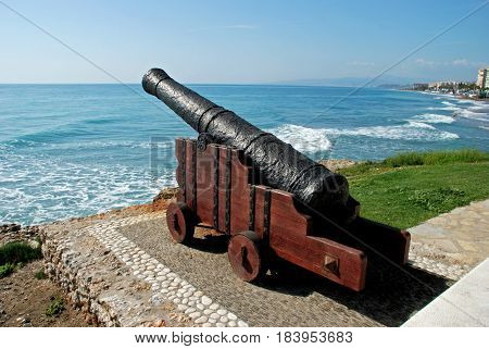 Cannon on the edge of sea with views along the beach and coastline Torrox Costa Malaga Province Andalusia Spain Western Europe.