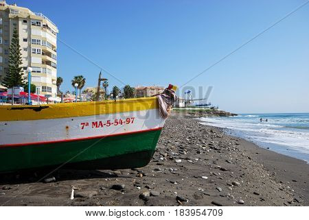 TORROX COSTA, SPAIN - OCTOBER 27, 2008 - Traditional wooden fishing boat on the beach Torrox Costa Malaga Province Andalusia Spain Western Europe, October 27, 2008.