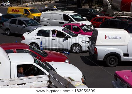 MEXICO CITY, MEXICO - FEB 09, 2017: Traffic stands at a standstill on a Paseo Reforma intersection.