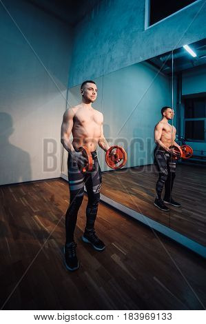 Brutal Strong Athletic Man Pumping Up Muscles And Train In Gym Workout Bodybuilding Concept Backgrou