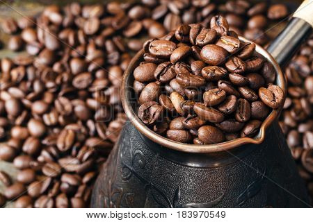 Copper Coffee Pot For Preparation Of Coffee On  Scattered Coffee Grains