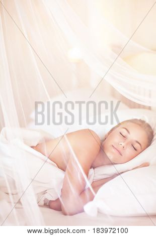 Pretty female sleeping at home in the bed under beautiful transparent valance, peace and relaxation, healthy luxury lifestyle