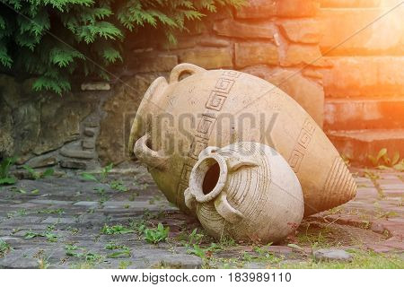 Decorative amphora in the garden in sunlights