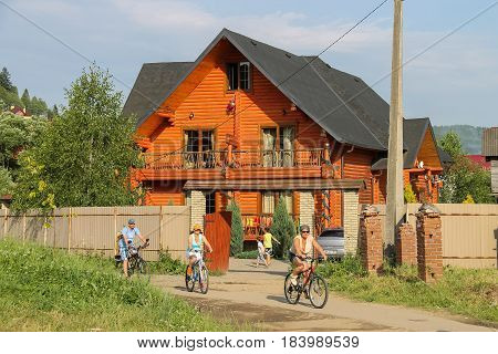 Schodnica Ukraine - June 30 2014: People riding bicycles. Carpathians