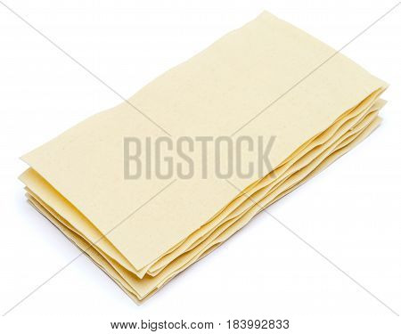 dried uncooked lasagna pasta sheets isolated over the white background