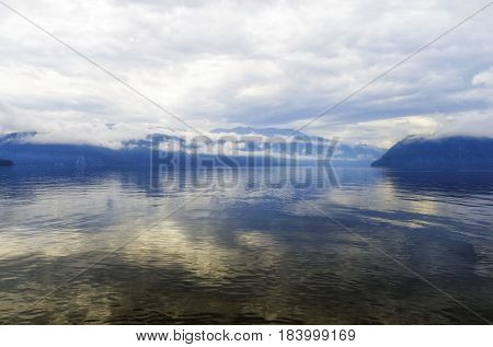 Siberia. Teletskoe lake, view of Cape Kuwan in the morning in cloudy weather