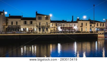Main Port Of The Yeu Island With Its Picturesque Architecture And Its Fishing Boats