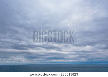 Dramatic Seascape With Grey Cloudy Sky Over It