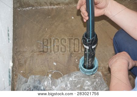 Contractor Installing And Repairborehole  Water Pipe. Borehole Water Pipe.