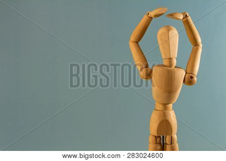 Wooden Doll As A Model For Drawing On A Neutral Background. Concept Of Protecting Your Head From Bum