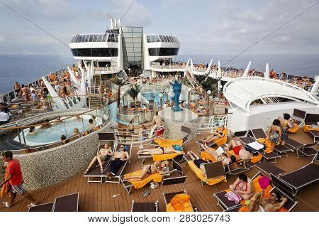 Passenger Ferry, Midsea, Spain - June 09, 2012: Passengers Enjoy At Swimming Pool On Upper Deck Of T