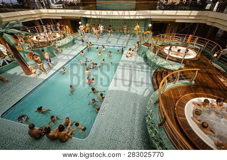 Passenger Ferry, Midsea, Spain - June 09, 2012: Passengers Enjoy At Swimming Pool On Upper Deck Of T