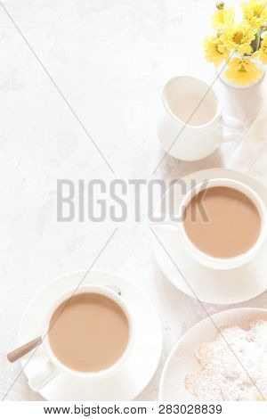 Breakfast On White Background. Morning Coffee With Cream, Pie And Yellow Flowers. Top View, Copy Spa