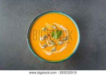 Butternut Squash Soup In A Bowl On Grey Background. Healthy Vegeterian Food. Halloween, Thanksgiving