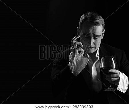Improvising. Comedian Man With Mime Makeup Hold Wine Glass. Drama Theatre Actor Miming. Performance 