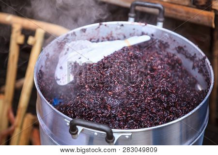 Traditional Thai Black Steamed Sticky Rice In Hot Steamer, Delicious Wholegrain Alternative To White