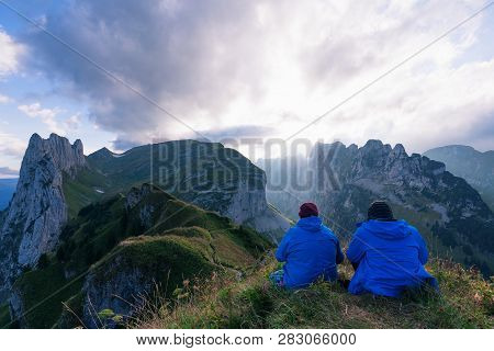 Mountain Landscape In The Swiss Alps With Jagged Peaks And A Pristine Blue Mountain Lake In The Vall
