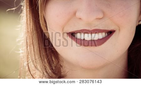 Beautiful Girl With Cherry Red Lips And White Teeth Is Smiling