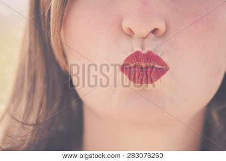 Cherry Red Lips Of Young Girl Are Kissing