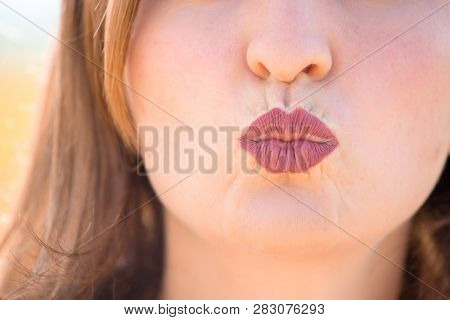 Cherry Red Lips Of Young Girl Are Kissing