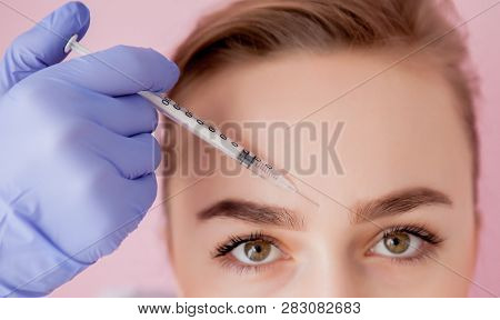 The Doctor Cosmetologist Makes The Rejuvenating Facial Injections Procedure For Tightening And Smoot
