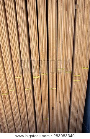 Large Rectanguler Wood Panels Stacked Up Together In Display