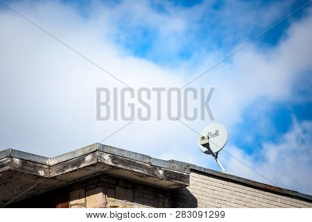 Montreal, Canada - November 8, 2018: Bell Canada Logo On A Satellite Dish On A House In  Montreal, Q