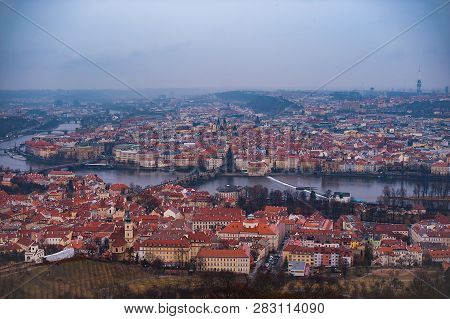 View Of The Red Roofs, Vltava And Bridges In Prague. Stare Misto And Mala Strana. Overcast Weather
