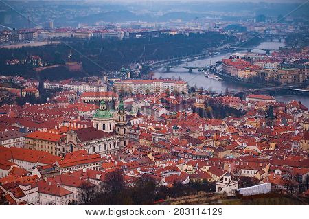 View Of The Red Roofs, Vltava And Bridges In Prague. Stare Misto And Mala Strana. Overcast Weather