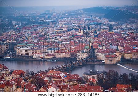 View Of The Red Roofs, Vltava And Bridges In Prague. Stare Misto And Mala Strana. Overcast Weather