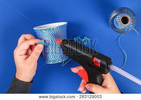 Diy Pencil Holder Plastic Glass Sour Cream, Yogurt Wrapped Thread Blue Background. Decoration Flower