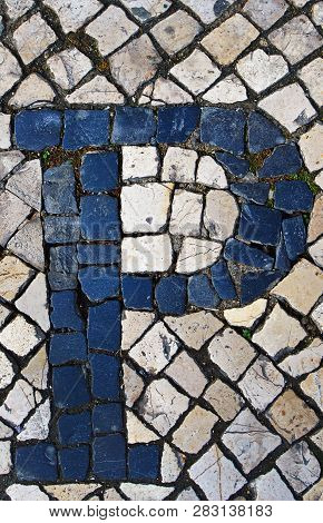 Portuguese Sidewalk Of Calcada In The Form Of The Letter P. Lisbon, Portugal