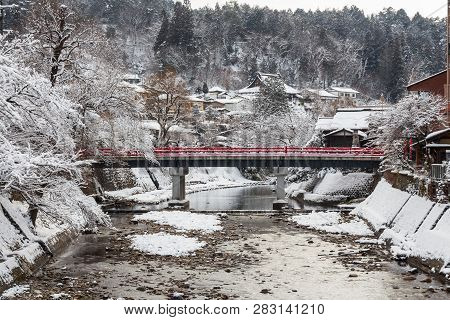 Nakabashi Bridge With Snow Fall And Miyakawa River In Winter Season . Landmark Of Hida - Gifu - Taka