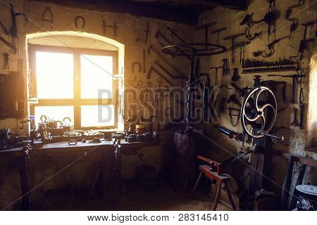 Tranditional Smithy Workshop Interior With Vintage Tools