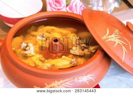 Food Specialty From Yunan Province, China: Air-pot Chicken Or Steam Pot Chicken. The Chicken Was Ste