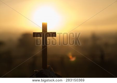 Christ Jesus  Cross In The Sunrise Colored Sky Background, Worship,  Religious Concept, Eucharist Th