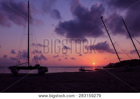 Hobie Cat Or Catamaran On The Beach At Beautiful Sunrise Early Morning, Silhouette Asian Man With Pa