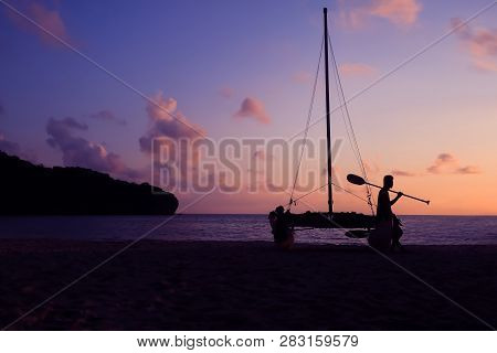Hobie Cat Or Catamaran On The Beach At Beautiful Sunrise Early Morning, Silhouette Asian Man With Pa