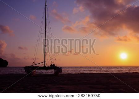 Hobie Cat Or Catamaran On The Beach At Beautiful Sunrise Early Morning, Silhouette Asian Man With Pa
