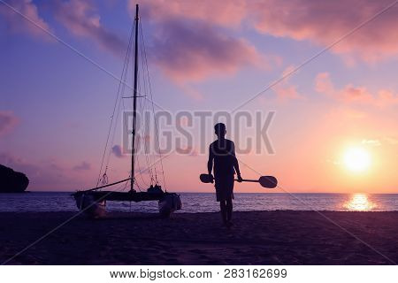 Hobie Cat Or Catamaran On The Beach At Beautiful Sunrise Early Morning, Silhouette Asian Man With Pa