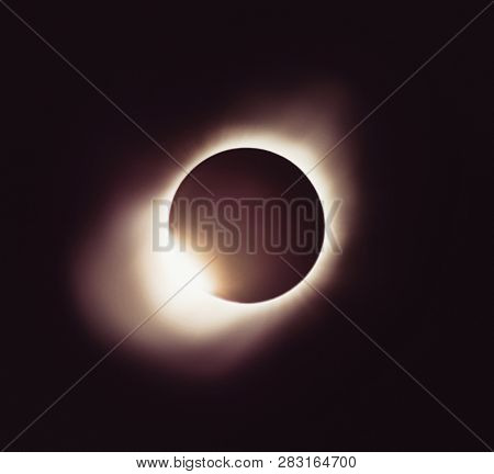 Moon eclipse. Full ssolar eclipse. Planet with a glow