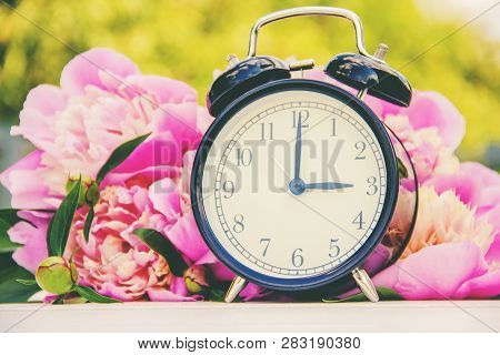 Spring Flowers And Alarm Clock. Change The Time.
